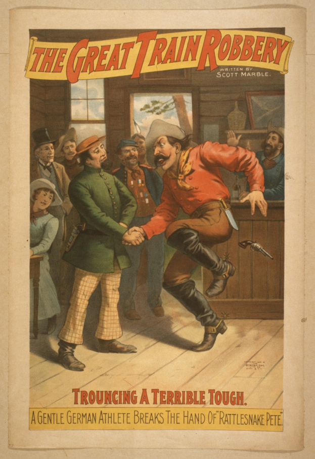 Ein Plakat, das eine Gruppe von Menschen auf einem Boden zeigt, einer hält eine Waffe, mit Text oben und unten: "Die große Zugraub - Trouching ein Schreckliches Tough".