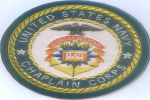Ein rundes Patch mit einem blauen Hintergrund und einem weißen Rand, das den Text 'United States Navy Chaplain Corps' in Weiß zeigt, in der Mitte zentriert.