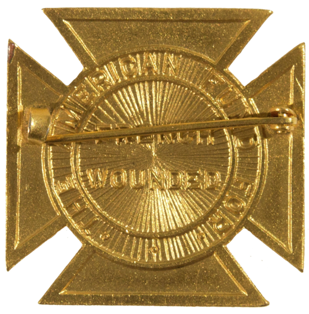 Gold American Fire Department badge with a star insignia, centered with text.