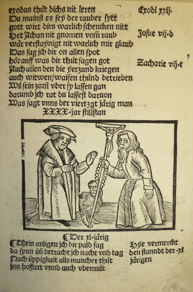 Eine bedruckte Seite in einer fremden Sprache mit zwei Männern im Hintergrund, möglicherweise aus einem Lehrbuch.