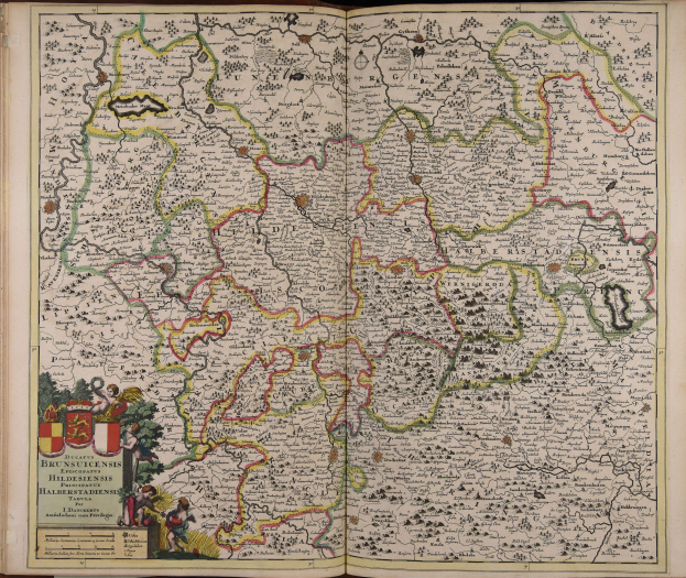Offenes Buch mit detaillierter Deutschlandkarte mit geografischen Merkmalen wie Flüssen, Bergen und Städten sowie begleitendem Text.