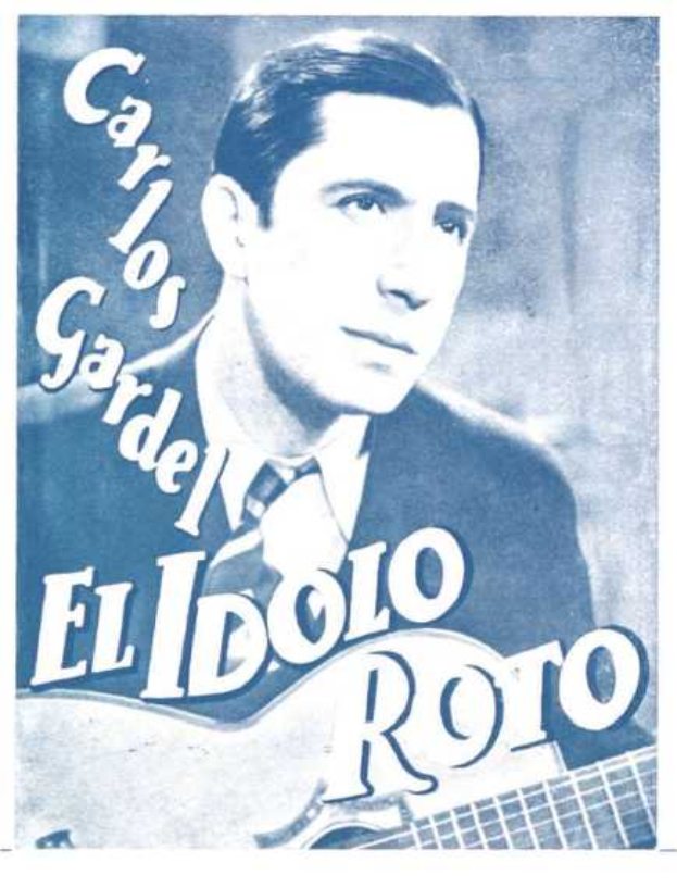 Ein Plakat, das El Idolo Roro, einen spanischen S├Ąnger-Schriftsteller, mit einer Gitarre in der Hand zeigt, der ein wei├čes Hemd und einen schwarzen Anzug tr├Ągt, mit zurückgek├Ąmmten Haaren und einem ernsten Gesichtsausdruck, vor einem hellblauen Hintergrund mit fetter schwarzer Schrift.