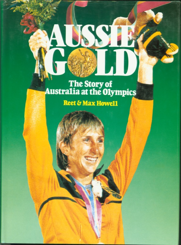 Ein Buch mit dem Titel "Aussie Gold: The Story of Australia at the Olympics" mit einer Person, die einen Blumenstrauß hält und eine goldene Medaille trägt.